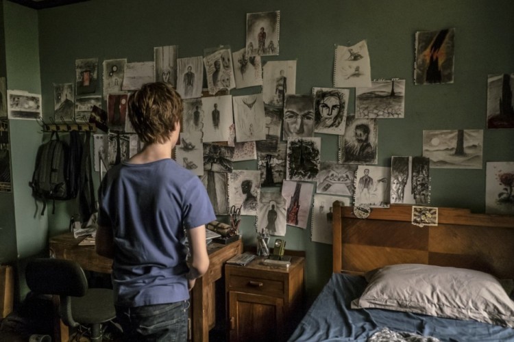 Jake Chambers (Tom Taylor) in his room in Columbia Pictures' THE DARK TOWER.